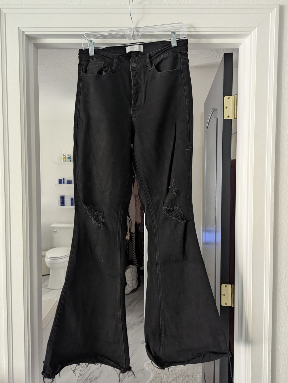 High-Rise Black Bell Bottoms with Distressed Detail